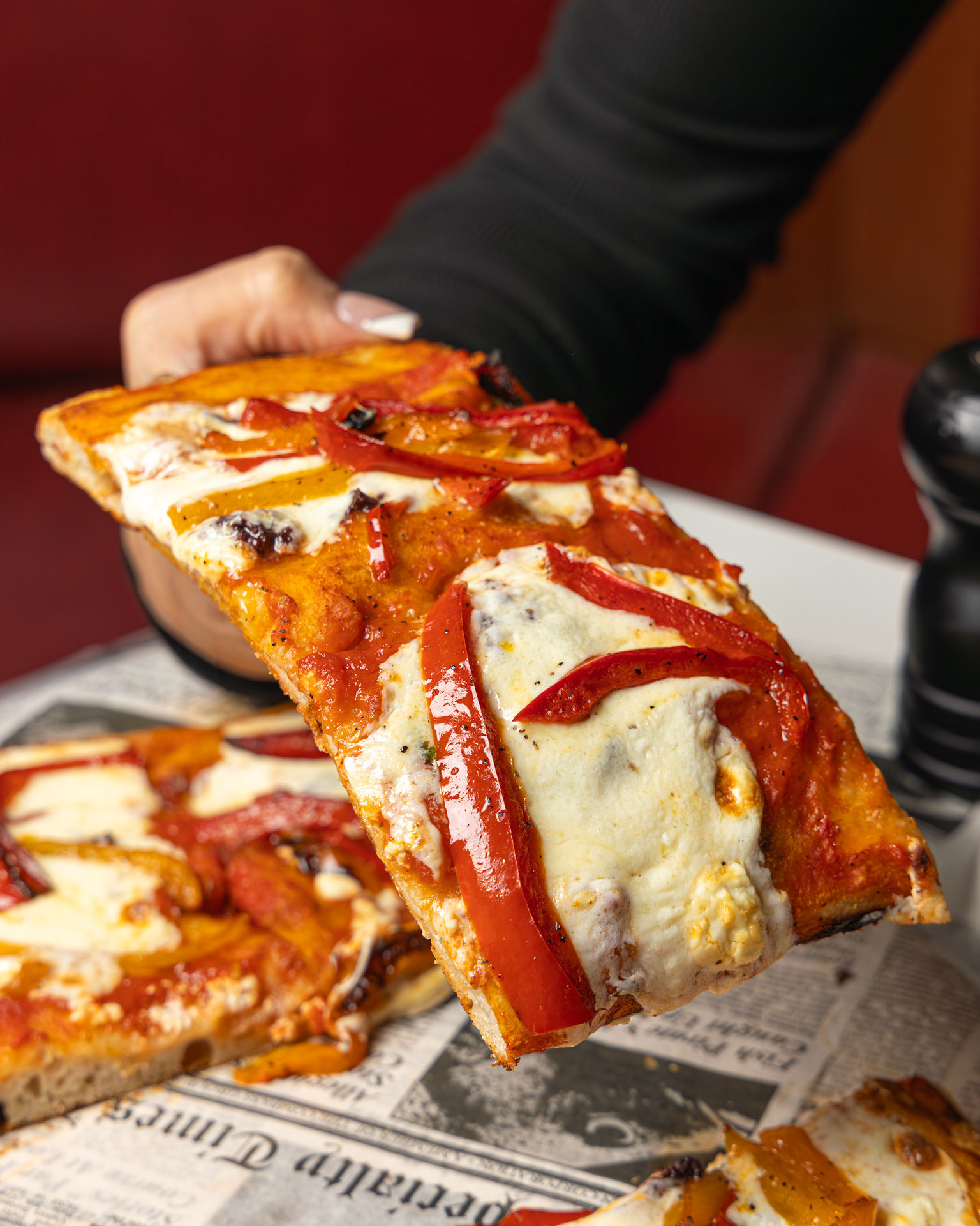 Detroit-style pizza with roasted red and yellow peppers